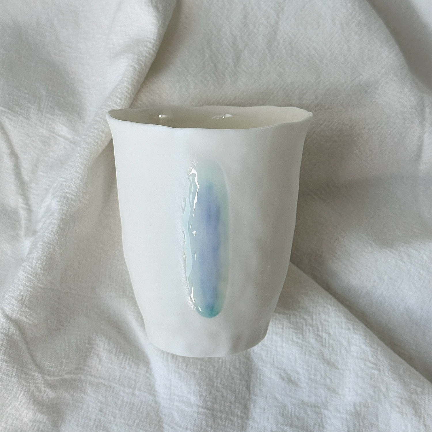 Jiayu · Flowing Eternity · Hand-Pinched White Porcelain Cup