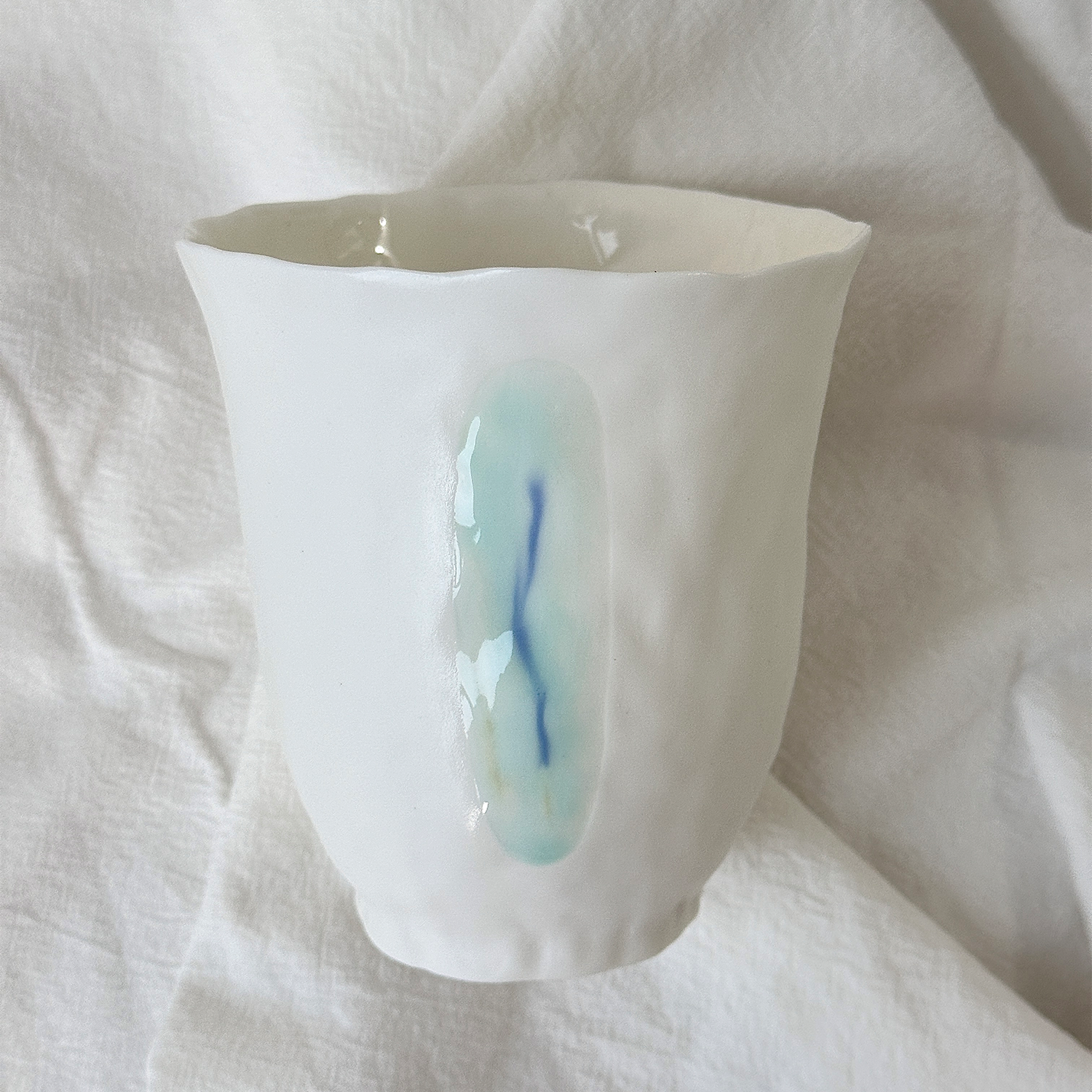 Jiayu · Flowing Eternity · Hand-Pinched White Porcelain Cup