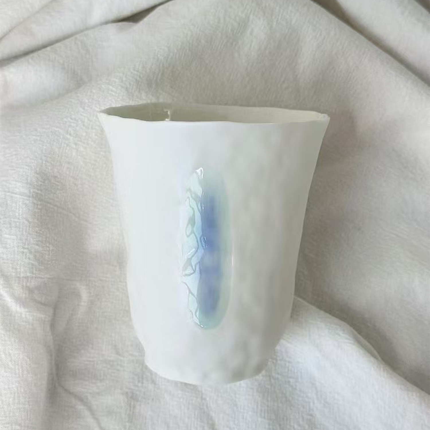 Jiayu · Flowing Eternity · Hand-Pinched White Porcelain Cup