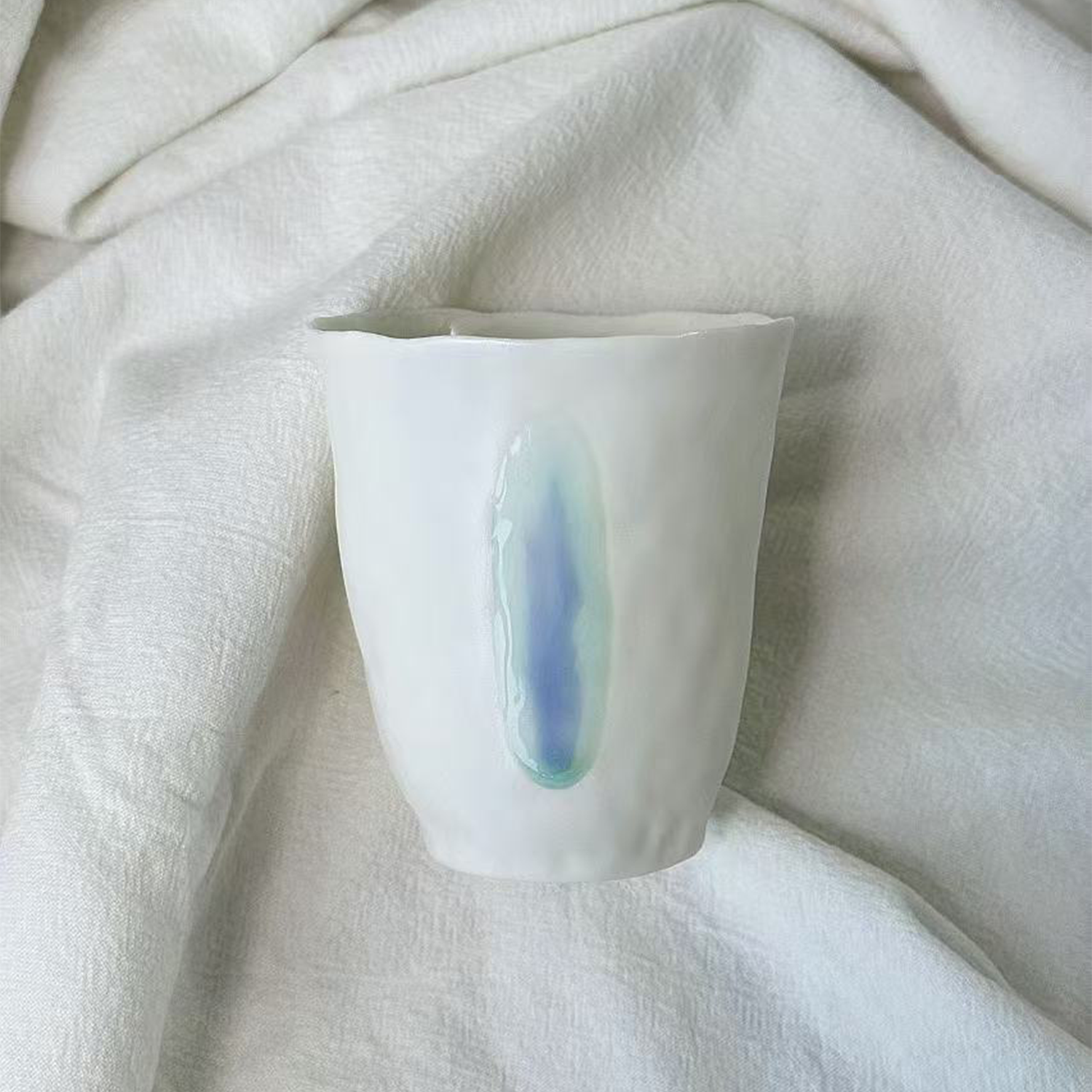 Jiayu · Flowing Eternity · Hand-Pinched White Porcelain Cup