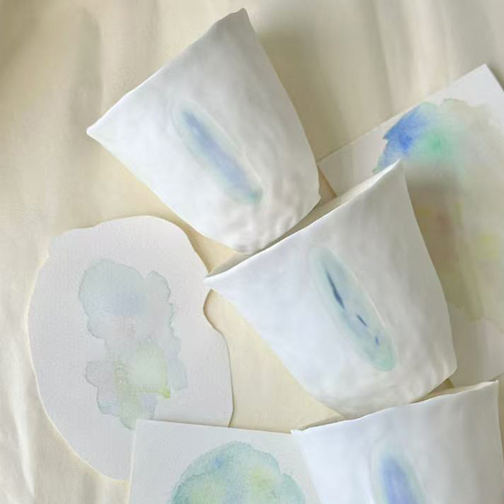 Jiayu · Flowing Eternity · Hand-Pinched White Porcelain Cup